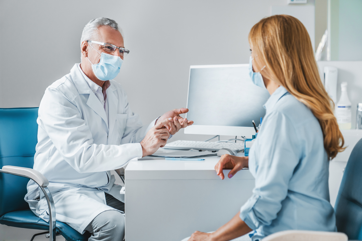 interventional pain management doctor with patient